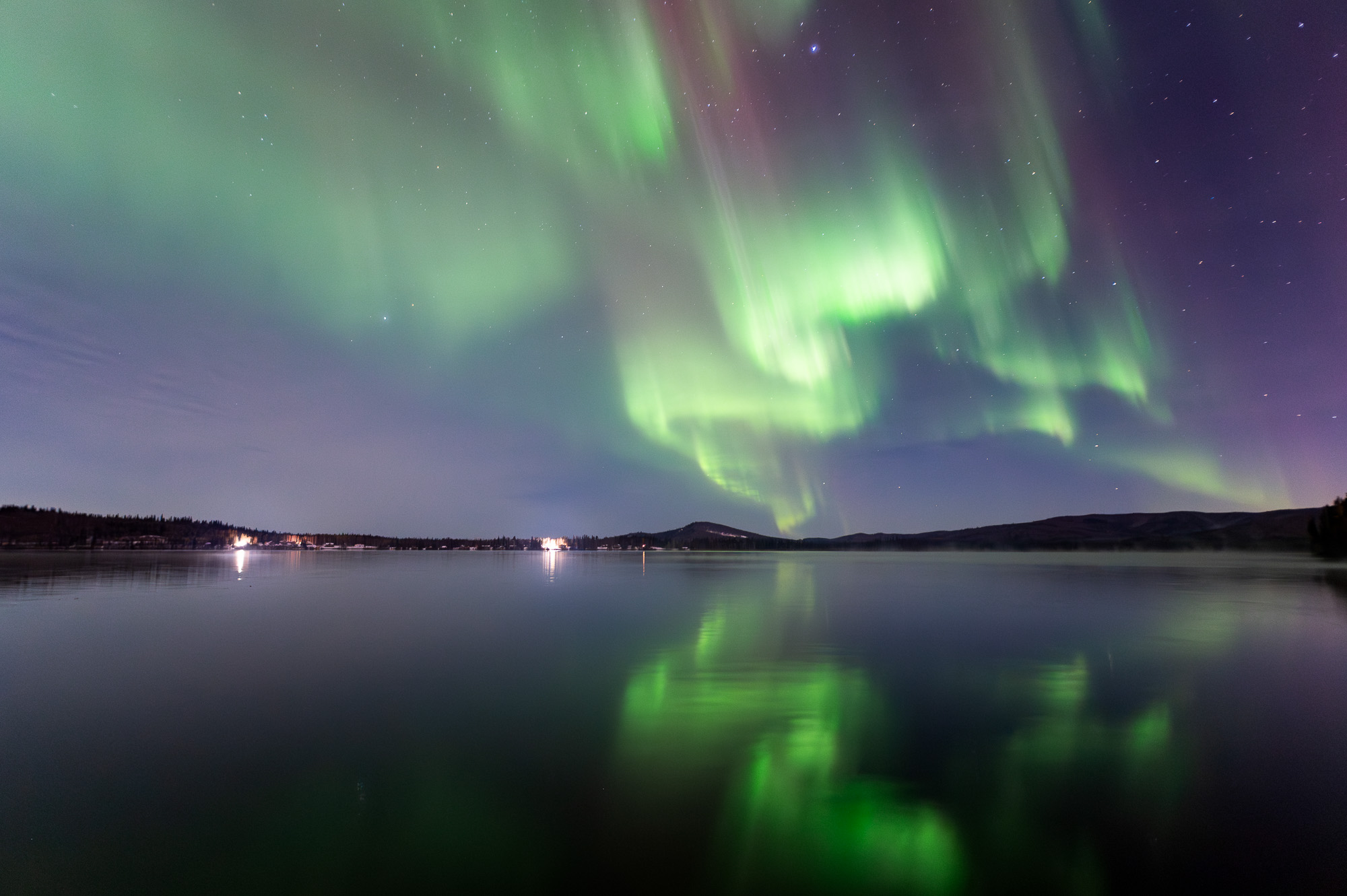 Aurora reflecting on a lake in Alaska