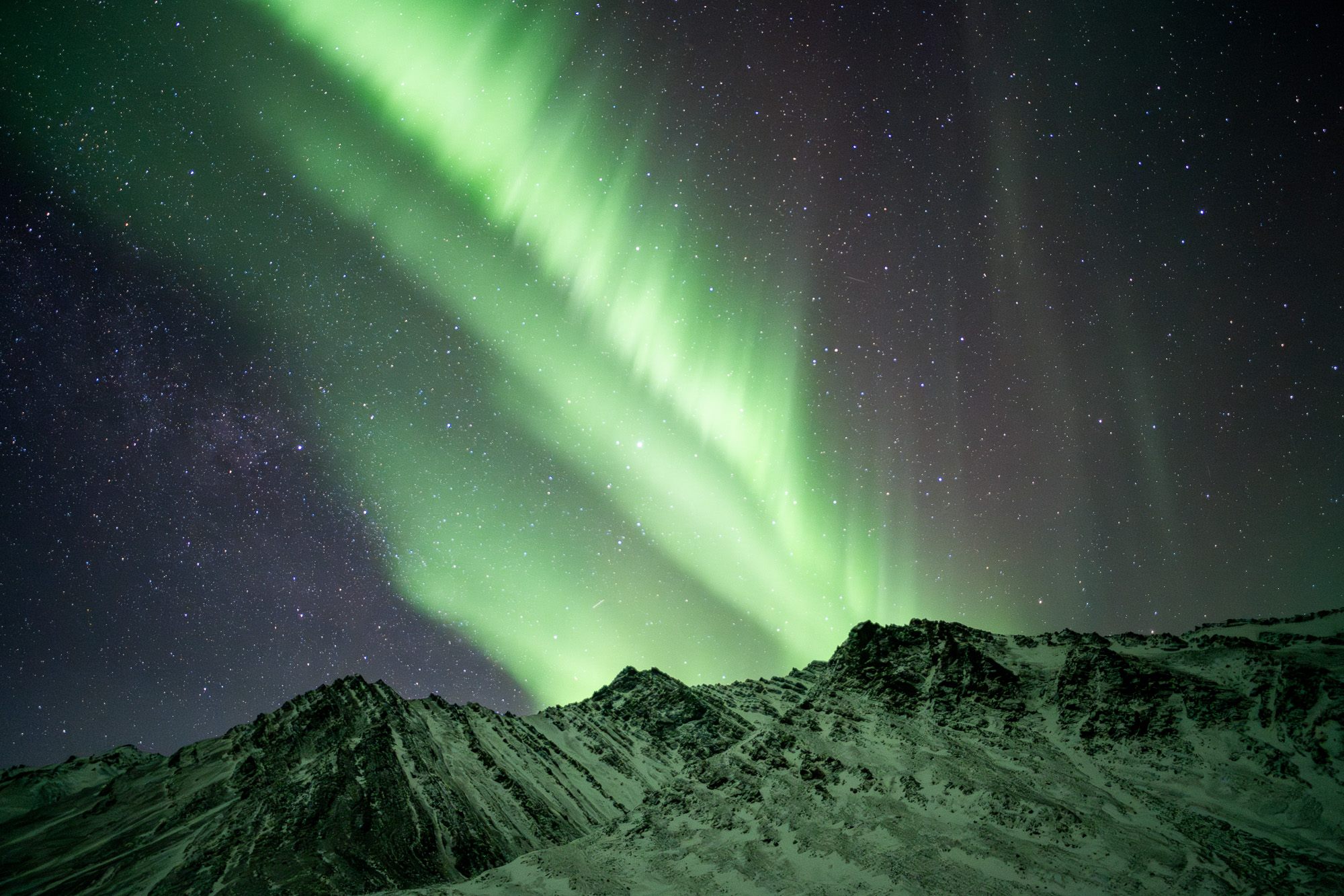 Aurora above mountains in Alaska