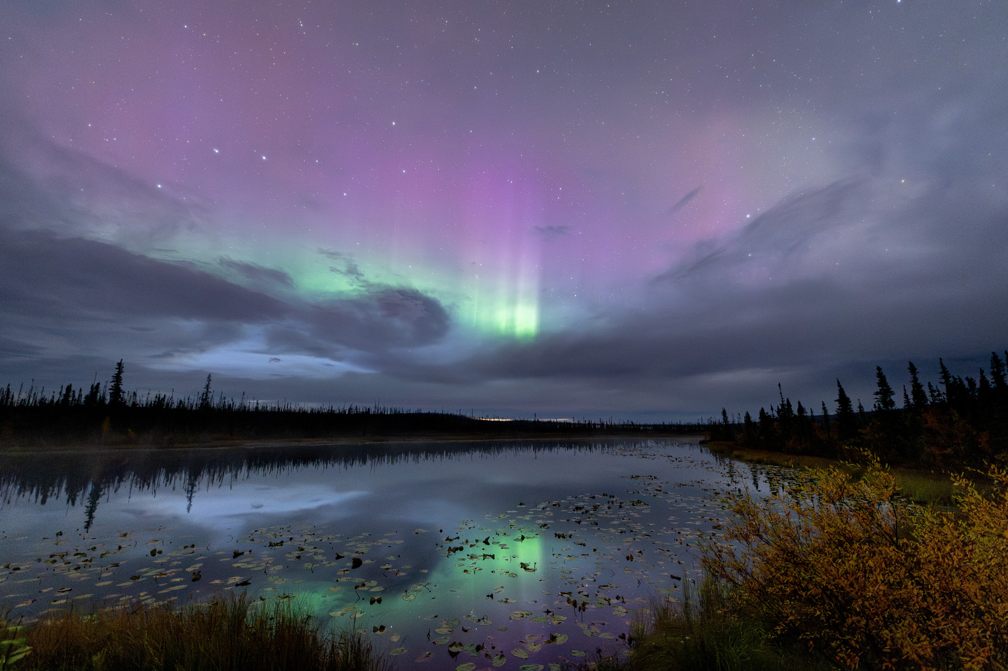 Aurora reflecting on a lake in Alaska